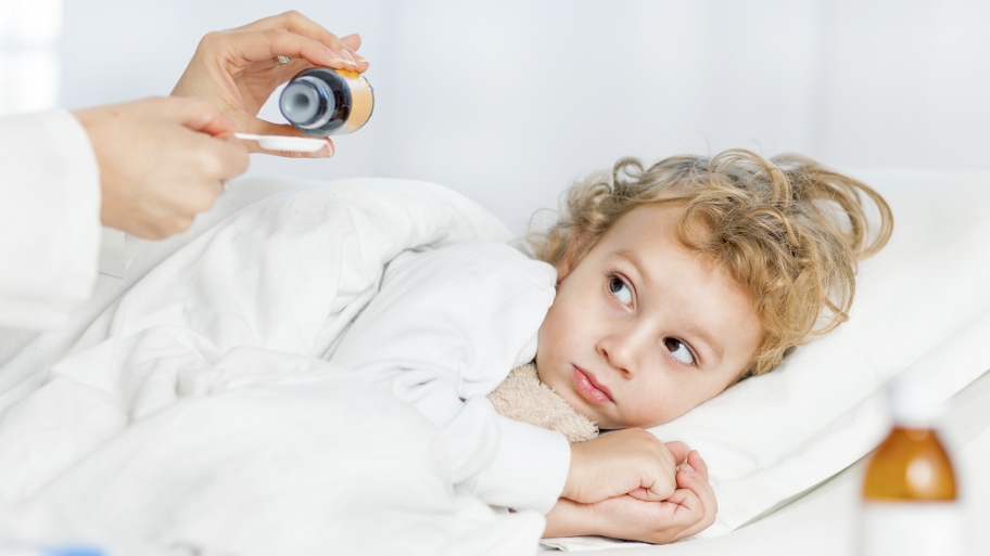 child getting medicine